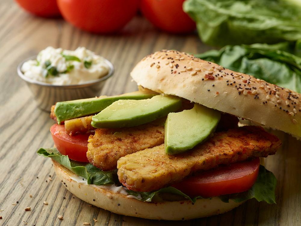 TLT Bagel Sandwich (Tempeh, Lettuce, Tomato) with Avocado and Basil Mayo | Savory