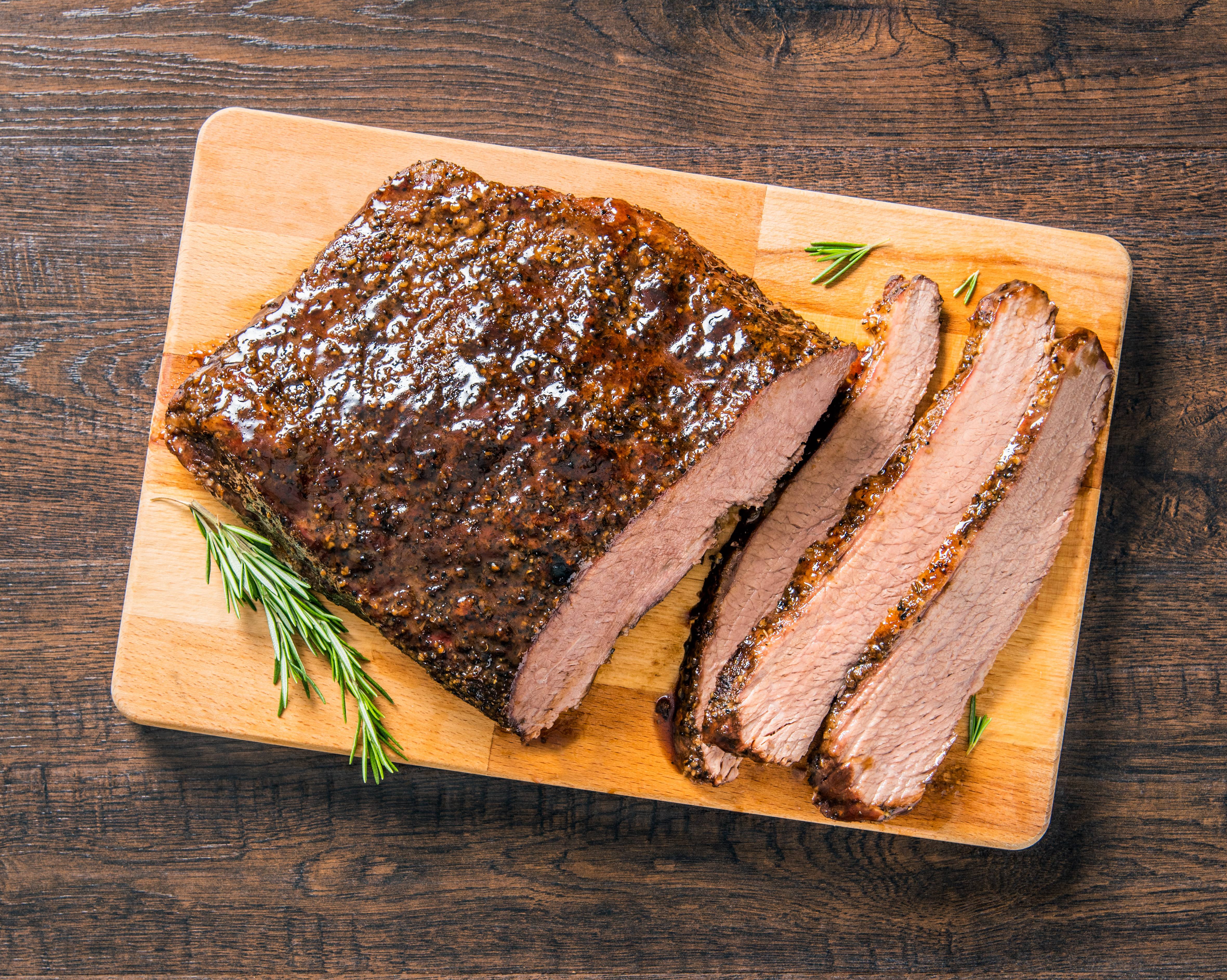 https://www.savoryonline.com/app/uploads/recipes/236677/smoked-spoon-roast-chuck-roast-or-brisket-with-brown-sugar-mop-sauce.jpg