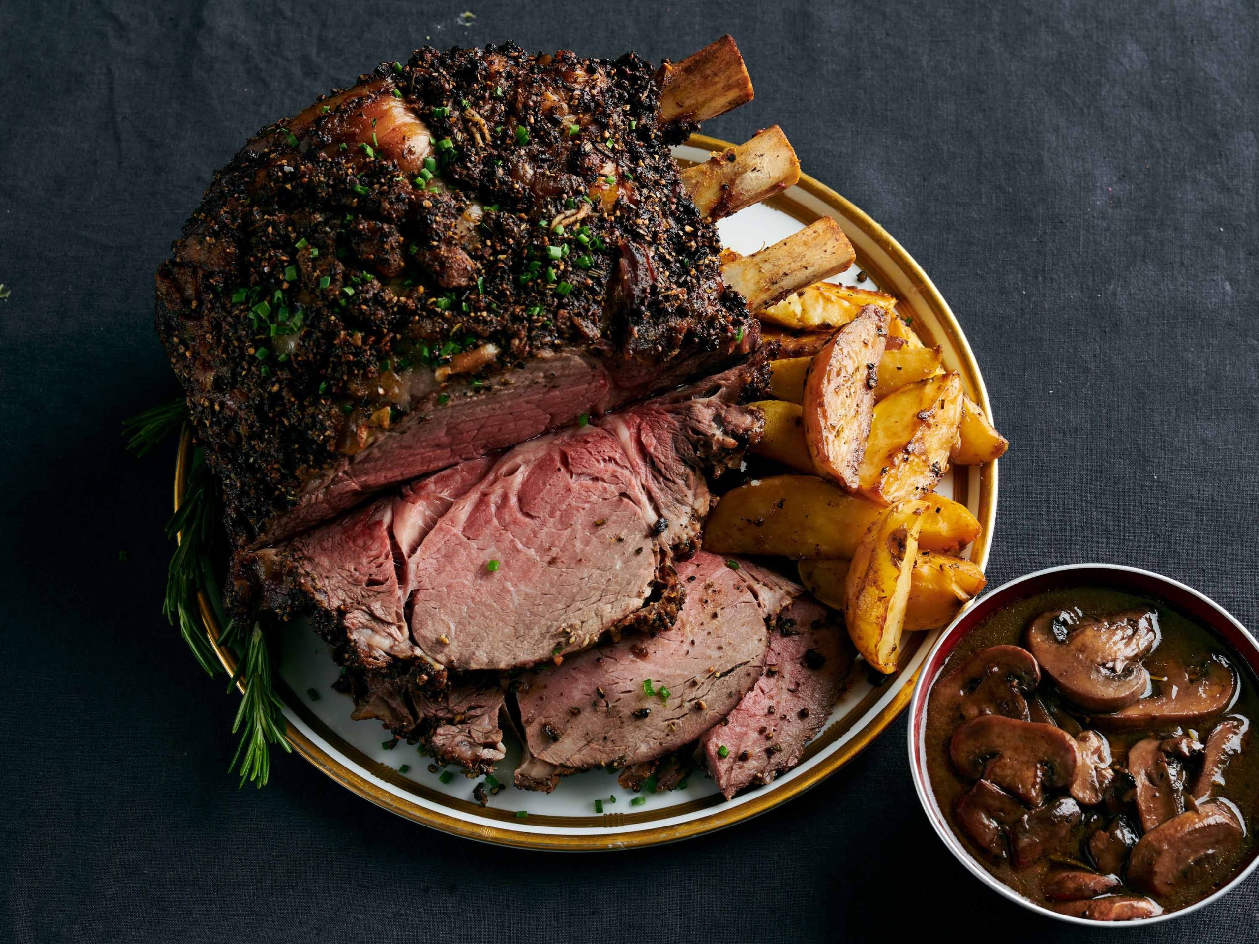 Standing Rib Roast with Potatoes and Mushroom Red Wine Jus Savory