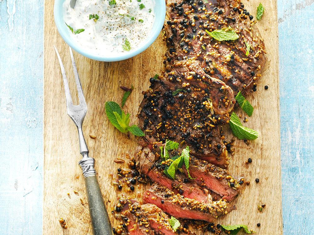 Grilled Spiced Ribeye Steaks with Garlic-Mint Sauce | Savory